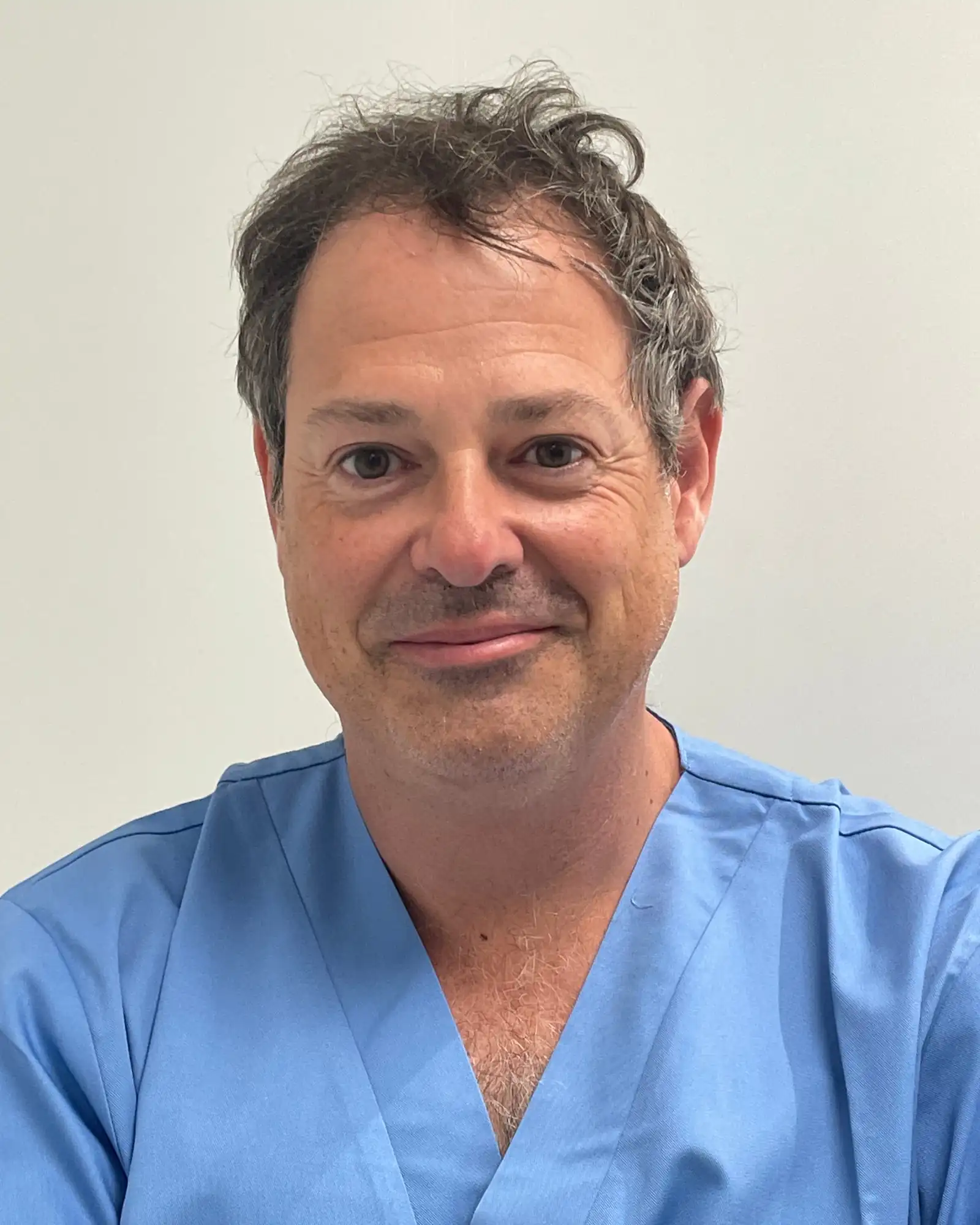 Dr. Javier Lara in surgical scrubs
